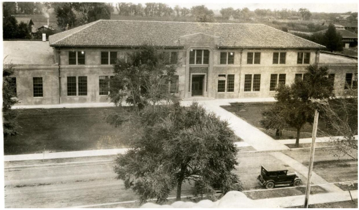 A historic black and white photo of Walker Hall from the 1920s