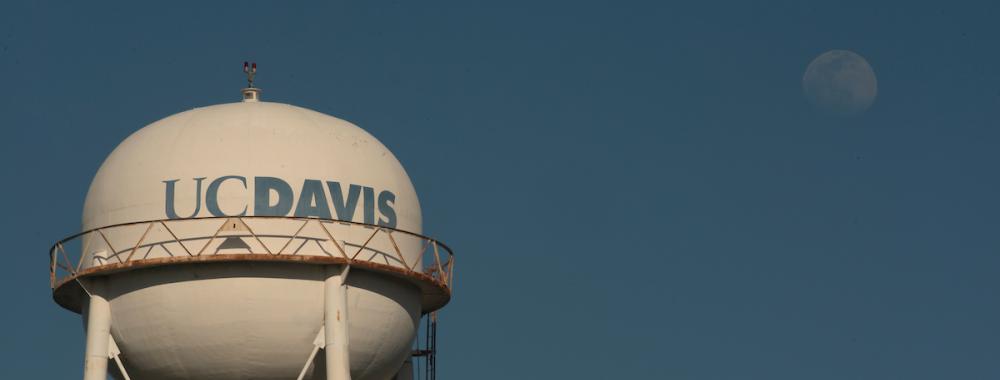 The gibbous moon rises over Water Tower on March 26, 2021.