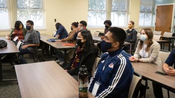 Envision students sitting in classroom during information session 