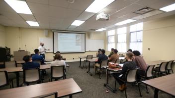 Envision students in lecture room during information session