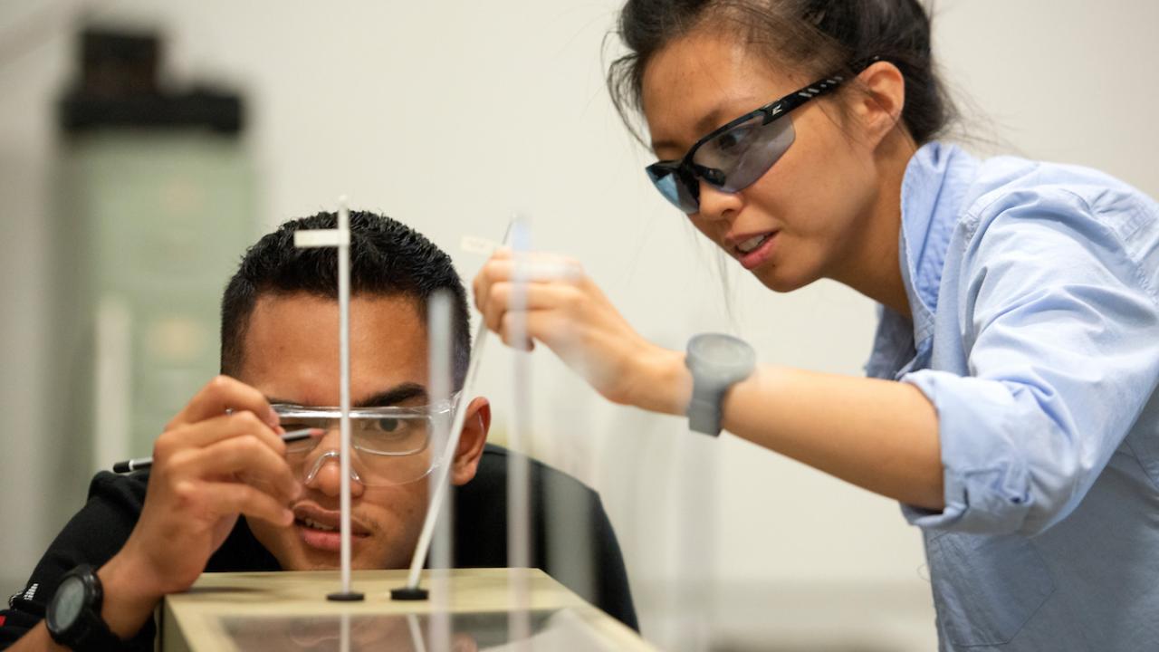 Izman Radzi, a mechanical engineering major, looks for the ambient temperature in the lab with Jessica Shum, a PhD candidate in aerospace engineering and teaching assistants, during the engineering class of Exerimental Methods for Thermal Fluids on July 9, 2019. 