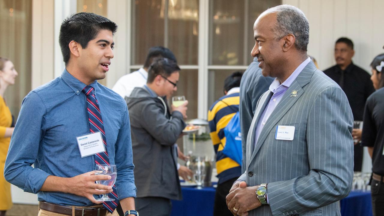 Daniel Castenada talks with UC Davis Chancellor May at Envision UC Davis event