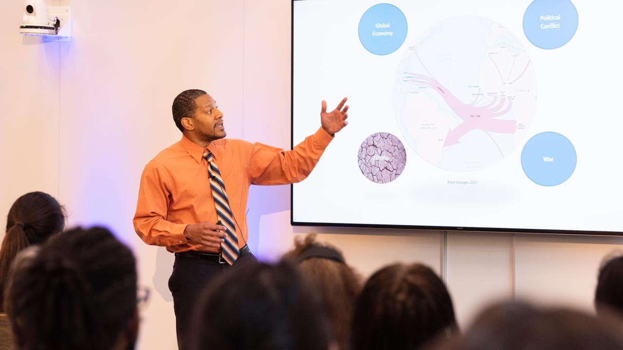 student gives Grad Slam presentation to audience