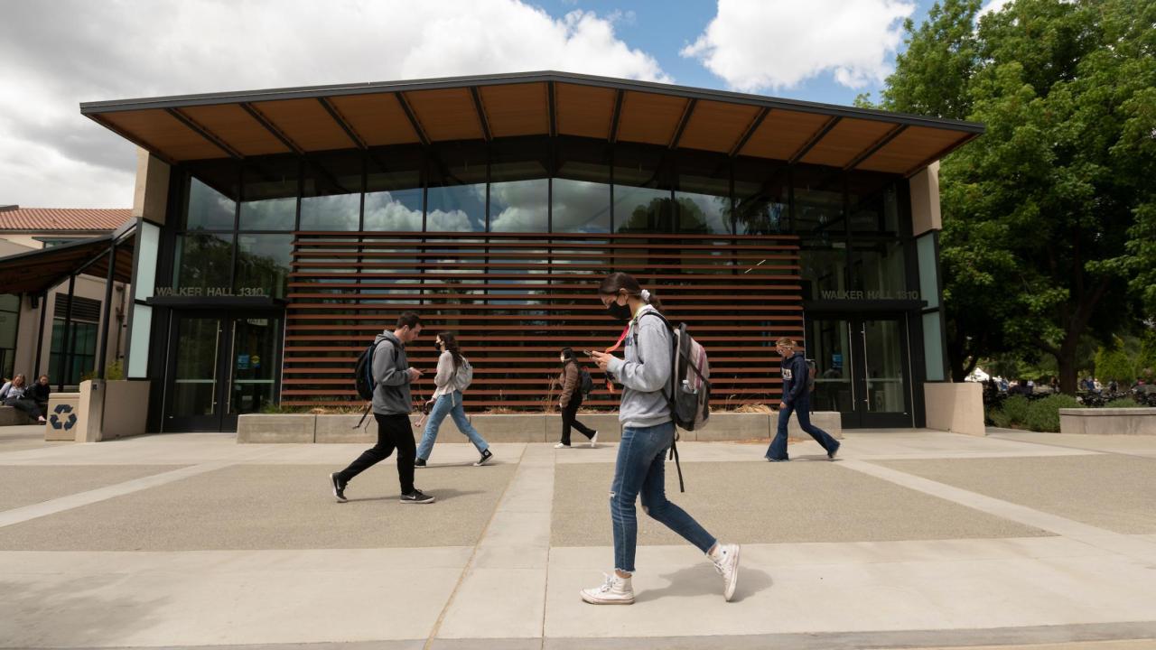 Students walk the Promenade and passed Walker Hall on May 9, 2022