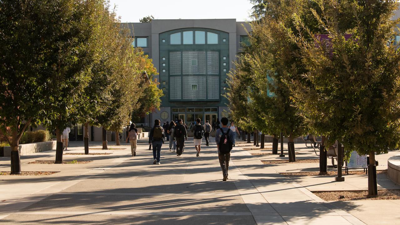 Students walk to Shield Library during the First Day of classes.