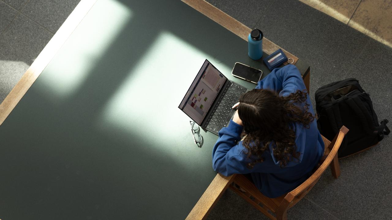 A student studies for finals in Shields Library.
