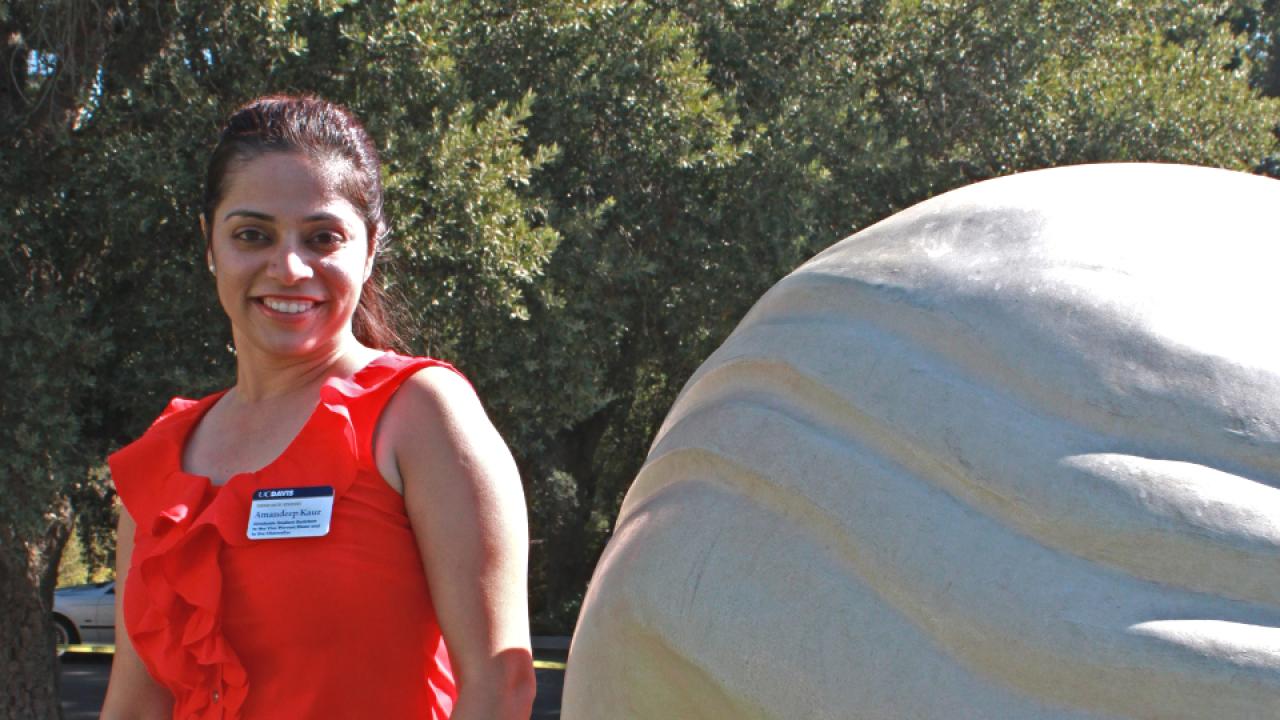 Amandeep next to one of the several Egghead sculptures located at UC Davis.