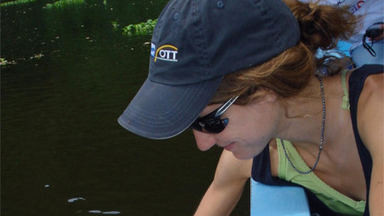 Amber collecting water samples.