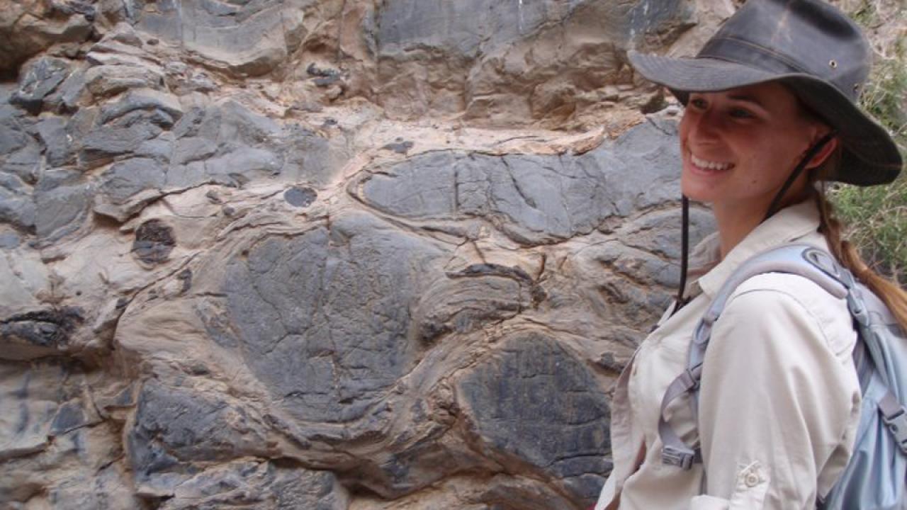 Amy Williams next to rock formations.