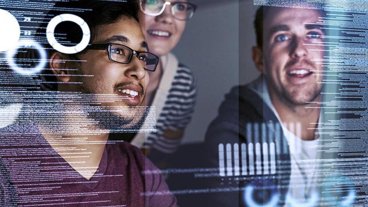 Business analytics students viewing computer screen