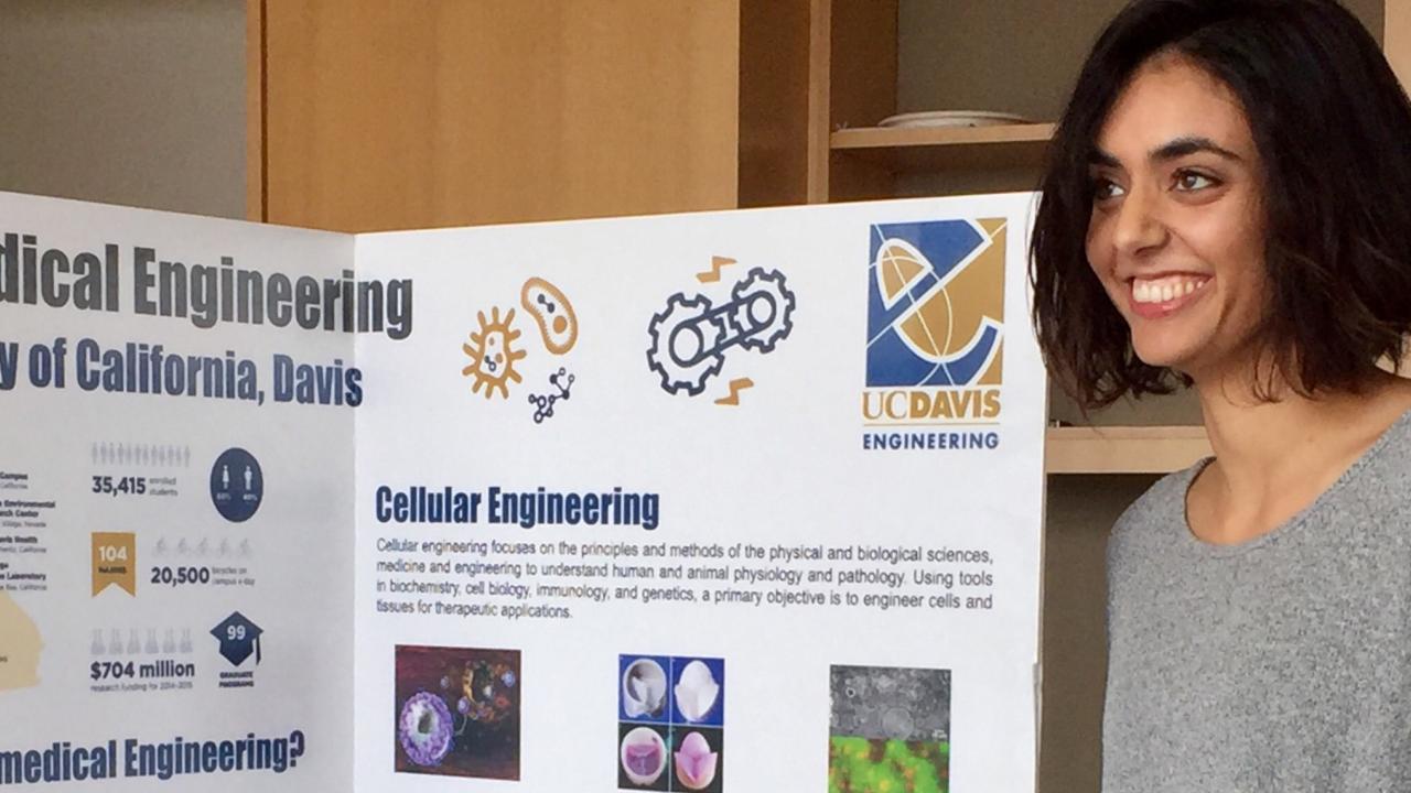 UC Davis graduate student Divya Kernik in front of a scientific poster