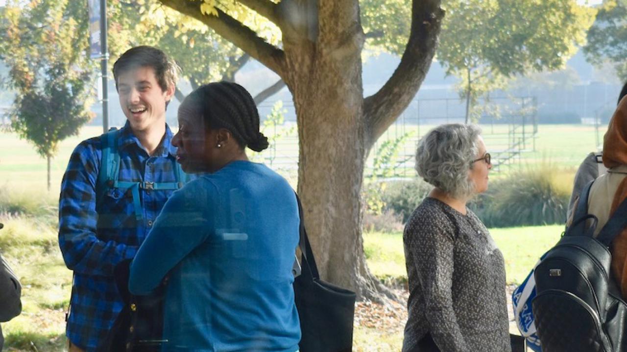 Fellows wrapping up discussions after a meeting. Bonnie Shea/UC Davis