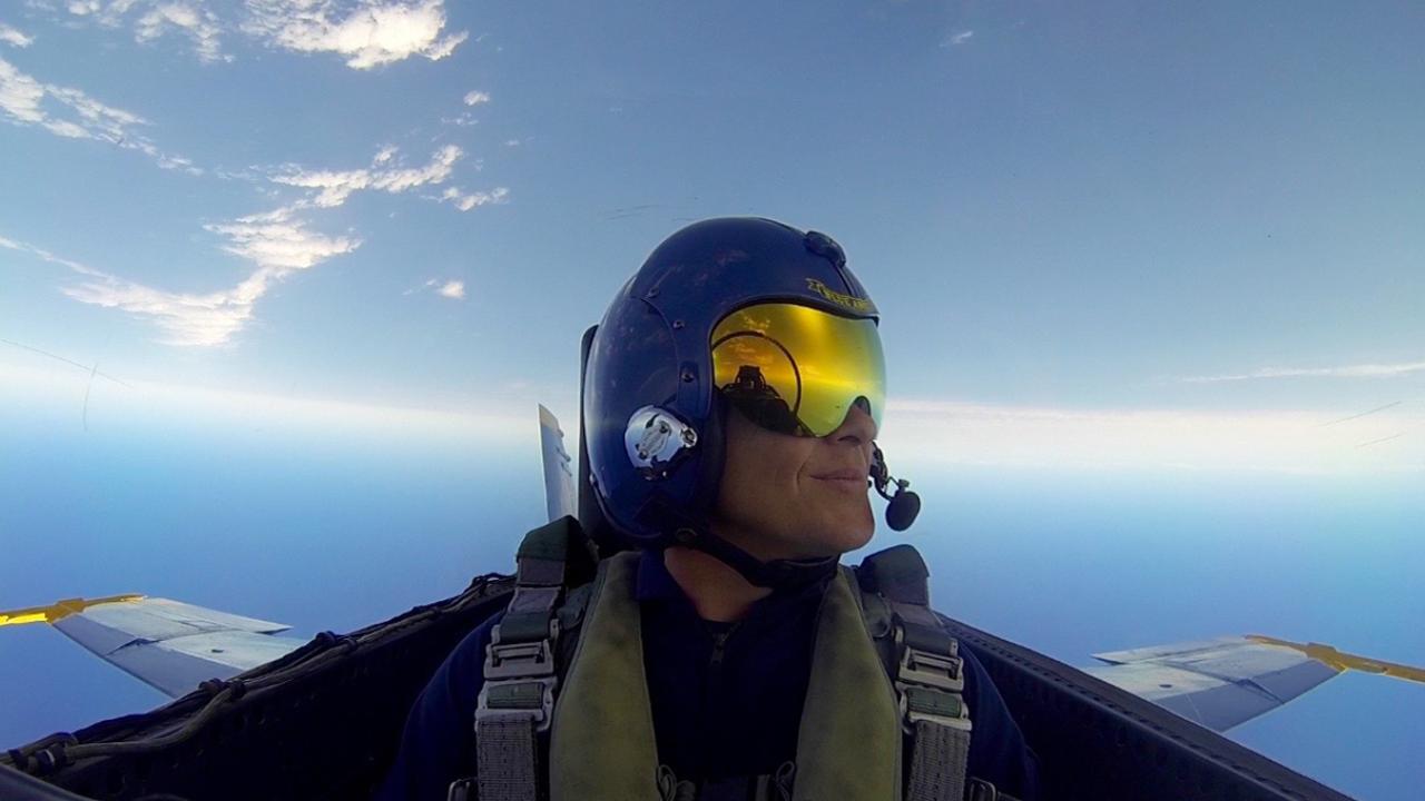 JP Delplanque looks out over the Pacific ocean while sitting in the cockpit of a Blue Angels jet. 
