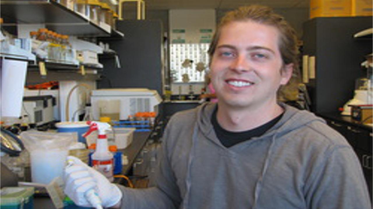 Thomas Williams smiling in the lab.