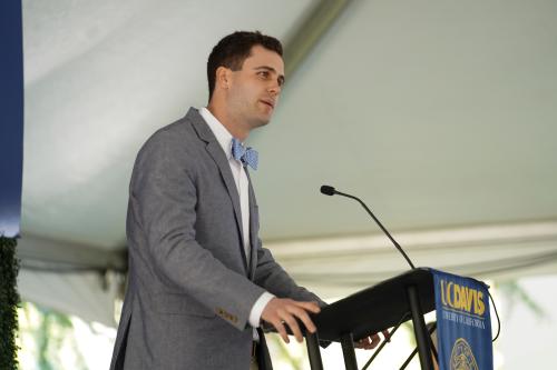 Minnick gives a speech in front of the podium at the Graduate Center Grand Opening Celebration 