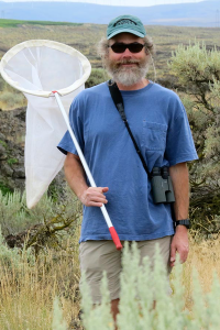 Dr. Thomas Coombs-Hahn in the field with a net. 