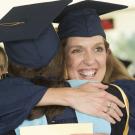 A hug is shared at UC Davis Graduate Studies Commencement.