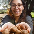 Erika Estrada holding walnuts