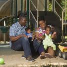 African American family sitting at playground
