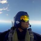 JP Delplanque looks out over the Pacific ocean while sitting in the cockpit of a Blue Angels jet. 