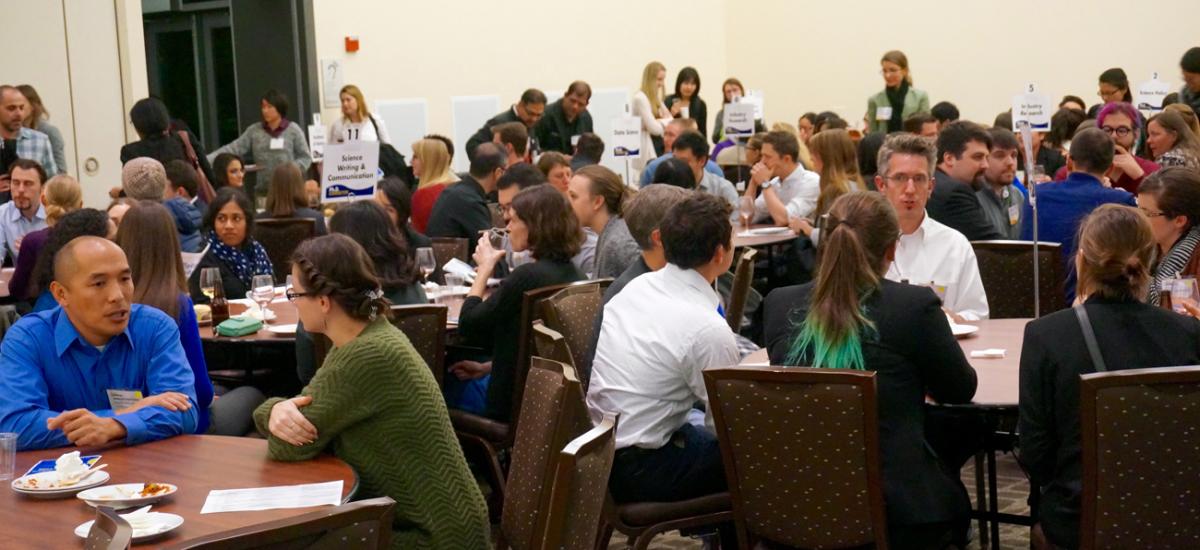 Graduate stuudents and postdoctoral scholars talk with career specialists at the PhD Connector  event.