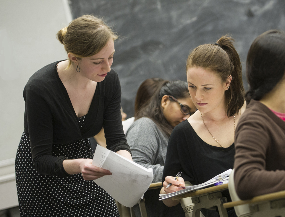 Michelle Cohn working with a student in the classroom