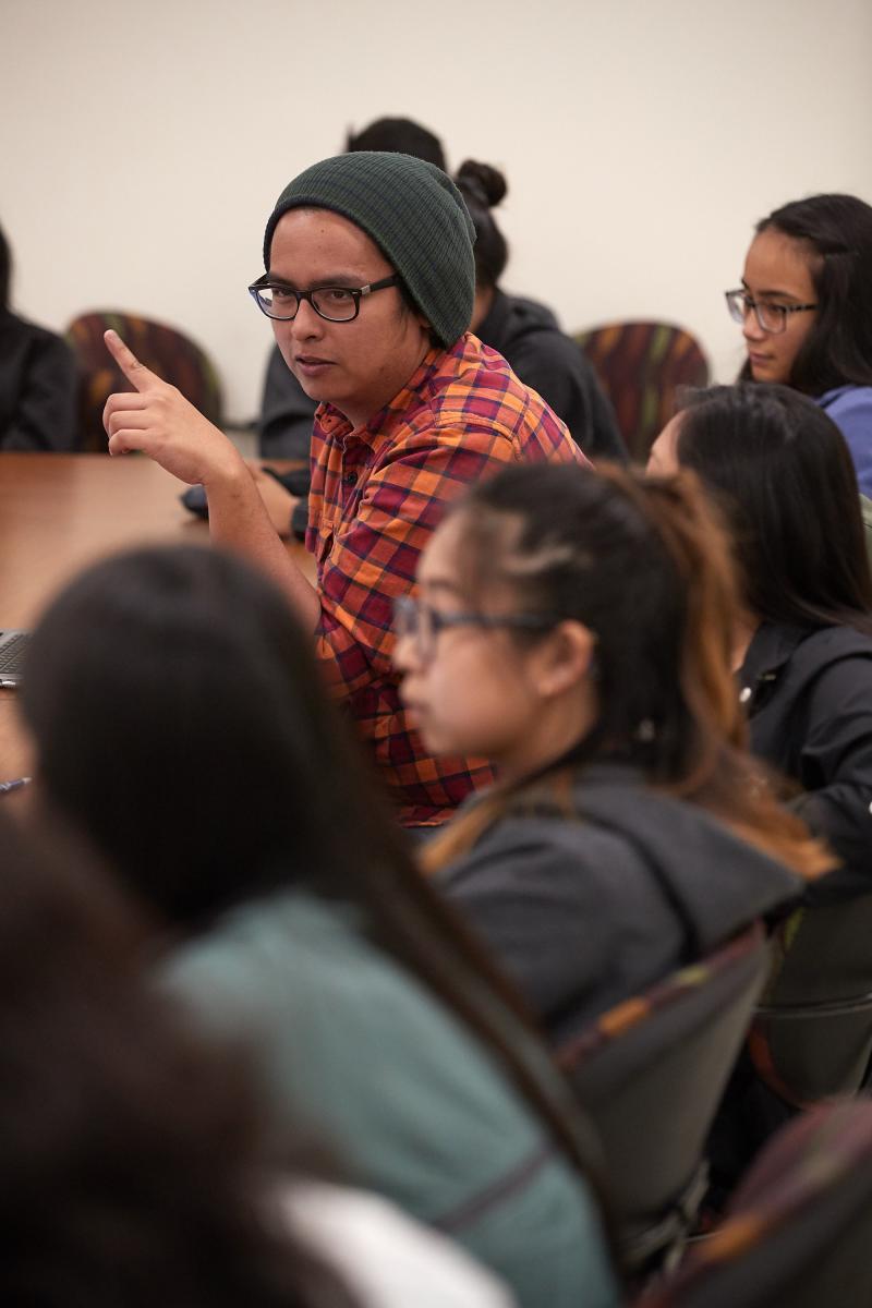 Taggueg makes a comment at a roundtable discussion (Fred Greaves)